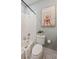 Bright bathroom with white subway tile in the shower and charming black and white floor tiles at 2911 Old Tavern Ct, Mount Pleasant, SC 29466