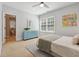 Comfortable bedroom featuring a bright ensuite bathroom and stylish striped dresser at 2911 Old Tavern Ct, Mount Pleasant, SC 29466