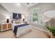 Stylish bedroom with unique decor, including an octopus wall art and rattan bedside tables at 2911 Old Tavern Ct, Mount Pleasant, SC 29466