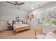 Bedroom featuring a light colored carpet, a ceiling fan and a wooden bed frame at 2911 Old Tavern Ct, Mount Pleasant, SC 29466