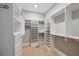 Spacious walk-in closet with custom shelving, drawers, and ample storage for organized living at 2911 Old Tavern Ct, Mount Pleasant, SC 29466