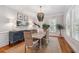 Elegant dining area with natural light, featuring a stylish chandelier and sophisticated decor at 2911 Old Tavern Ct, Mount Pleasant, SC 29466