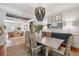 Formal dining room with a beaded chandelier, stylish decor, and an open floor plan flowing into the living area at 2911 Old Tavern Ct, Mount Pleasant, SC 29466