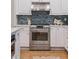 Well-equipped kitchen with stainless steel appliances and blue backsplash at 2911 Old Tavern Ct, Mount Pleasant, SC 29466