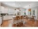 Eat-in kitchen with bright white cabinets, stainless appliances, and central island with barstool seating at 2911 Old Tavern Ct, Mount Pleasant, SC 29466