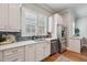 Bright kitchen with stainless appliances, tile backsplash, white cabinets, and hardwood floors at 2911 Old Tavern Ct, Mount Pleasant, SC 29466