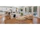 Bright living room flows into a kitchen with counter seating and access to an outdoor patio through glass doors at 2911 Old Tavern Ct, Mount Pleasant, SC 29466