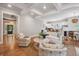 Bright living room with beautiful ceiling beams, hardwood floors, and decor in neutral colors at 2911 Old Tavern Ct, Mount Pleasant, SC 29466