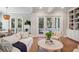 Living room with white sofa, hardwood floors, and large doors to outside patio at 2911 Old Tavern Ct, Mount Pleasant, SC 29466