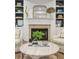 Living room featuring a decorative fireplace, custom shelving, and stylish furniture at 2911 Old Tavern Ct, Mount Pleasant, SC 29466