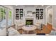 Comfortable living room with built-in shelving, a fireplace, and a view of the outdoor area through sliding glass doors at 2911 Old Tavern Ct, Mount Pleasant, SC 29466