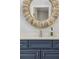 Close up on stylish vanity in bathroom featuring a round mirror and designer fixtures at 2911 Old Tavern Ct, Mount Pleasant, SC 29466