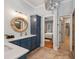 Beautiful bathroom with double sinks, stylish blue cabinetry, and designer finishes at 2911 Old Tavern Ct, Mount Pleasant, SC 29466