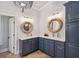 Elegant bathroom with double sink vanity, unique lighting, and refined decor at 2911 Old Tavern Ct, Mount Pleasant, SC 29466