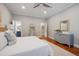Serene bedroom featuring hardwood floors and doorway views to the en-suite bathroom at 2911 Old Tavern Ct, Mount Pleasant, SC 29466