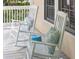 Relaxing porch scene with white rocking chairs and decorative pillows, perfect for enjoying the outdoors at 2911 Old Tavern Ct, Mount Pleasant, SC 29466