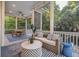 Inviting screened-in porch with comfortable seating and outdoor dining area at 2911 Old Tavern Ct, Mount Pleasant, SC 29466