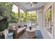 Inviting screened porch featuring a comfortable seating area and serene outdoor views at 2911 Old Tavern Ct, Mount Pleasant, SC 29466