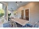 Spacious screened porch with dining and lounge, connecting indoor and outdoor living at 2911 Old Tavern Ct, Mount Pleasant, SC 29466