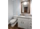 Powder room features a granite countertop and rustic wood mirror at 3 Sand Dollar Dr, Isle of Palms, SC 29451