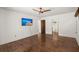 Bedroom with hardwood floors featuring a ceiling fan and an en suite bathroom at 3 Sand Dollar Dr, Isle of Palms, SC 29451