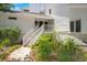 Home entrance with an inviting staircase and lush landscaping at 3 Sand Dollar Dr, Isle of Palms, SC 29451