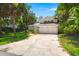 Inviting two-story home with a spacious driveway and mature landscaping at 3 Sand Dollar Dr, Isle of Palms, SC 29451