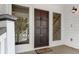 Elegant front door with sidelights, creating a welcoming entryway at 3 Sand Dollar Dr, Isle of Palms, SC 29451
