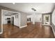 Open floor plan with hardwood floors, showing the living area, fireplace and kitchen at 3 Sand Dollar Dr, Isle of Palms, SC 29451