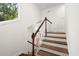 Staircase with stained wood treads and painted risers at 3 Sand Dollar Dr, Isle of Palms, SC 29451