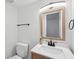 Bathroom featuring white cabinets and light wood framed mirror with matching fixtures at 415 Parkdale Drive # E-8, Charleston, SC 29414