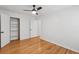 Bedroom with hardwood floors and a closet with shelving at 415 Parkdale Drive # E-8, Charleston, SC 29414