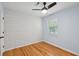This bedroom features hardwood floors, light blue walls, a ceiling fan and white plank accent wall at 415 Parkdale Drive # E-8, Charleston, SC 29414