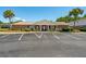 Clubhouse of neighborhood with large parking lot and manicured landscaping at 415 Parkdale Drive # E-8, Charleston, SC 29414