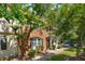 Charming brick townhouse with lush landscaping and a welcoming entrance at 415 Parkdale Drive # E-8, Charleston, SC 29414
