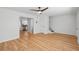 Spacious living room with hardwood floors, neutral decor, and access to the kitchen at 415 Parkdale Drive # E-8, Charleston, SC 29414