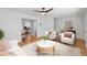 Staged living room featuring hardwood floors, ceiling fan and comfortable seating arrangement at 415 Parkdale Drive # E-8, Charleston, SC 29414