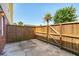 Fenced in patio with wooden fence, showing the concrete flooring and brick wall on the left at 415 Parkdale Drive # E-8, Charleston, SC 29414