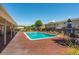 Community swimming pool with brick paver deck, lounge chairs, and manicured landscaping at 415 Parkdale Drive # E-8, Charleston, SC 29414