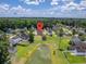 An aerial view shows the property's location near a pond and green space in the community at 4847 Cane Pole Ln, Summerville, SC 29485