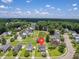 An aerial view shows the property's location near a pond and green space in the community at 4847 Cane Pole Ln, Summerville, SC 29485