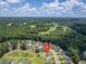 An aerial view shows the property's location near a pond and golf course in the community at 4847 Cane Pole Ln, Summerville, SC 29485