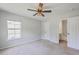 Comfortable bedroom with carpet flooring, a ceiling fan, and natural light from the window at 4847 Cane Pole Ln, Summerville, SC 29485