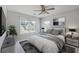 Cozy bedroom with a comfortable bed, ceiling fan, and lots of natural light at 4847 Cane Pole Ln, Summerville, SC 29485