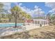 A view of the community pool, barn themed clubhouse, playground, and pergola covered area at 4847 Cane Pole Ln, Summerville, SC 29485