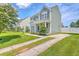 Charming two-story home with a driveway and freshly cut lawn at 4847 Cane Pole Ln, Summerville, SC 29485