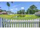 Scenic view of a pond surrounded by lush greenery and mature trees, perfect for relaxation at 4847 Cane Pole Ln, Summerville, SC 29485