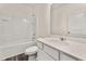 Clean bathroom with a shower-tub combo, vanity and white tile at 5005 Ferry Field Dr, Summerville, SC 29485