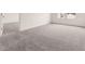Spacious bedroom with plush gray carpeting and natural light from the windows at 5005 Ferry Field Dr, Summerville, SC 29485