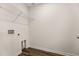 Bright laundry room featuring wood-look floors and built-in wire shelving for optimal organization at 5005 Ferry Field Dr, Summerville, SC 29485